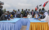The head of Sudan's sovereign council, Gen. Abdel-Fattah Burhan, seated center-left, President of South Sudan Salva Kiir, seated center, and President of Chad Idriss Deby, seated center-right, attend a ceremony to sign a peace deal between Sudan's transitional authorities and a rebel alliance, in Juba, South Sudan, Saturday, Oct. 3, 2020. Sudan's transitional authorities and a rebel alliance on Saturday signed the peace deal initialed in August that aims to put an end to the country's decades-long civil wars, in a televised ceremony in Juba, South Sudan marking the agreement. (AP Photo/Maura Ajak)