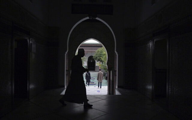A man walks inside a mosque in Paris, France, October 29, 2020. (AP/Thibault Camus, FILE)