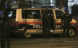 Police officers in position following a shooting attack, in Vienna, Austria, November 3, 2020. (Ronald Zak/AP)