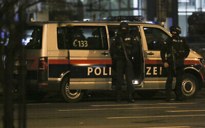 Police officers in position following a shooting attack, in Vienna, Austria, November 3, 2020. (Ronald Zak/AP)
