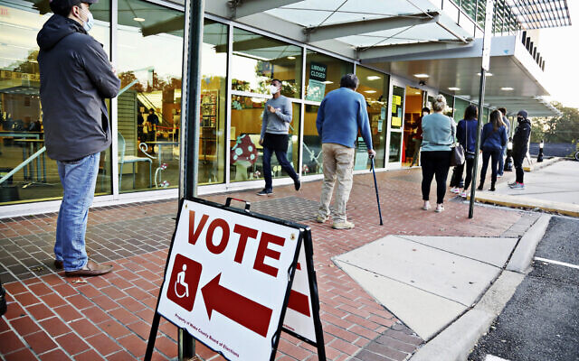 A steady line of voters wait outside of Cameron Village Library in Raleigh, North Carolina early Tuesday morning, Nov. 3, 2020, to cast their ballot on Election Day. (Juli Leonard/The News & Observer via AP) A steady line of voters wait outside of Cameron Village Library in Raleigh, North Carolina early Tuesday morning, Nov. 3, 2020, to cast their ballot on Election Day. (Juli Leonard/The News & Observer via AP)