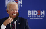 In this June 11, 2020, file photo Democratic presidential candidate former Vice President Joe Biden smiles while speaking during a roundtable on economic reopening with community members in Philadelphia. (AP Photo/Matt Slocum, File)
