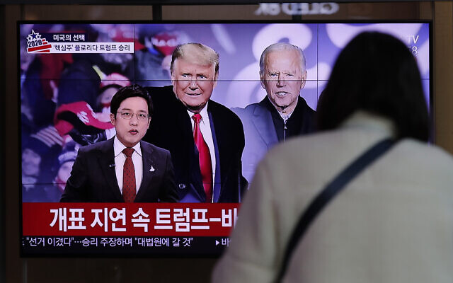 A TV screen shows images of U.S. President Donald Trump and Democratic presidential candidate former Vice President Joe Biden during a news program, at the Seoul Railway Station in Seoul, South Korea, Wednesday, Nov. 4, 2020. (AP Photo/Lee Jin-man) A TV screen shows images of U.S. President Donald Trump and Democratic presidential candidate former Vice President Joe Biden during a news program, at the Seoul Railway Station in Seoul, South Korea, Wednesday, Nov. 4, 2020. (AP Photo/Lee Jin-man)