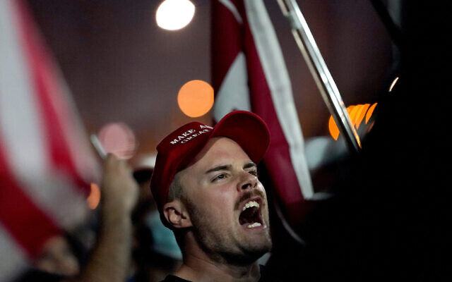 Supporters of US President Donald Trump rally outside the Maricopa County Recorders Office on November 4, 2020, in Phoenix. (AP Photo/Matt York) Supporters of US President Donald Trump rally outside the Maricopa County Recorders Office on November 4, 2020, in Phoenix. (AP Photo/Matt York)