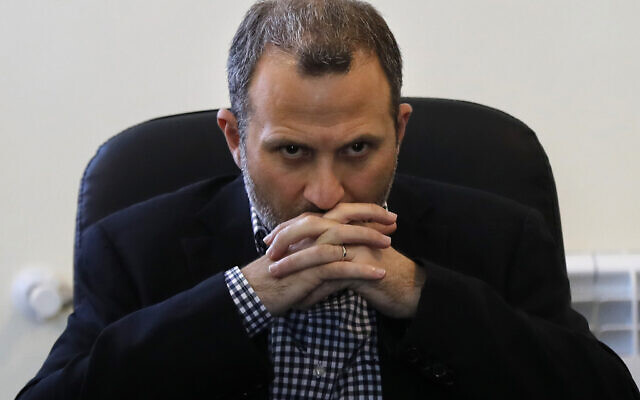 In this June 13, 2018 file photo, Lebanese Foreign Minister Gibran Bassil pauses during a news conference at a Syrian refugee camp, in Arsal, near the border with Syria, east Lebanon. The US treasury slapped sanctions Friday, Nov. 6, 2020, on Lebanon's ex-foreign minister and a leading Christian political ally of the Hezbollah group, according to the Treasury's website. (AP Photo/Hussein Malla) In this June 13, 2018 file photo, Lebanese Foreign Minister Gibran Bassil pauses during a news conference at a Syrian refugee camp, in Arsal, near the border with Syria, east Lebanon. The US treasury slapped sanctions Friday, Nov. 6, 2020, on Lebanon's ex-foreign minister and a leading Christian political ally of the Hezbollah group, according to the Treasury's website. (AP Photo/Hussein Malla)