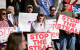 People demonstrate outside the Pennsylvania State Capitol on November 6, 2020, in Harrisburg, Pennsylvania, as vote counting continues following the US presidential elections. (AP Photo/Julio Cortez)