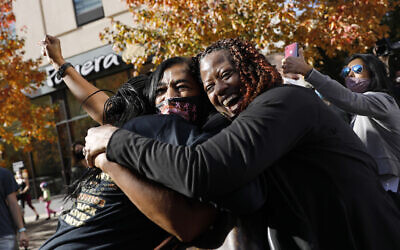 People celebrate Saturday, Nov. 7, 2020, in Philadelphia, after Democrat Joe Biden defeated President Donald Trump to become 46th president of the United States. (AP Photo/Rebecca Blackwell)