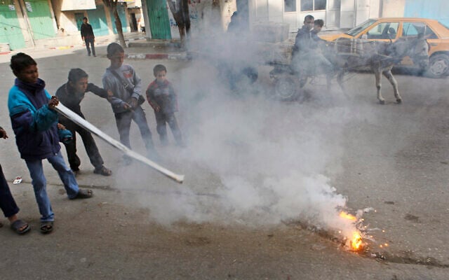 Children play with a flaming lump, allegedly containing white phosphorus, on a street in the town of Beit Lahiya, in the northern Gaza strip, January 19, 2009. (AP Photo/Ben Curtis, File) Children play with a flaming lump, allegedly containing white phosphorus, on a street in the town of Beit Lahiya, in the northern Gaza strip, January 19, 2009. (AP Photo/Ben Curtis, File)