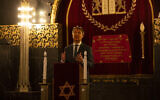 Rene de Reuver, speaking on behalf of the General Synod of the Protestant Church in the Netherlands, reads a statement at the Rav Aron Schuster Synagogue in Amsterdam, Netherlands, November 8, 2020. (AP Photo/Peter Dejong)
