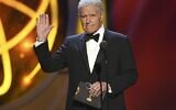 This May 5, 2019, file photo shows Alex Trebek gestures while presenting an award at the 46th annual Daytime Emmy Awards in Pasadena, Calif. Jeopardy!” host Alex Trebek died Sunday, Nov. 8, 2020, after battling pancreatic cancer for nearly two years. Trebek died at home with family and friends surrounding him, “Jeopardy!” studio Sony said in a statement. Trebek presided over the beloved quiz show for more than 30 years. (Photo by Chris Pizzello/Invision/AP)
