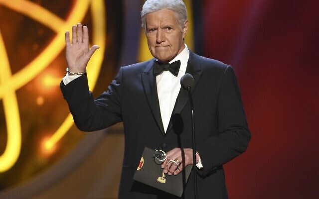 This May 5, 2019, file photo shows Alex Trebek gestures while presenting an award at the 46th annual Daytime Emmy Awards in Pasadena, Calif. Jeopardy!” host Alex Trebek died Sunday, Nov. 8, 2020, after battling pancreatic cancer for nearly two years. Trebek died at home with family and friends surrounding him, “Jeopardy!” studio Sony said in a statement. Trebek presided over the beloved quiz show for more than 30 years. (Photo by Chris Pizzello/Invision/AP)