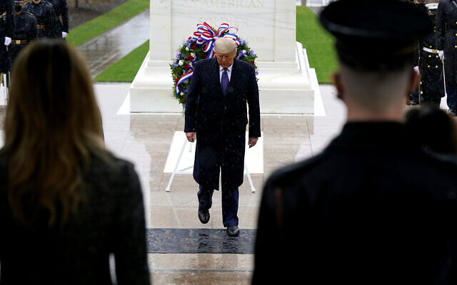 US President Donald Trump participates in a Veterans Day wreath laying ceremony at the Tomb of the Unknown Soldier at Arlington National Cemetery in Arlington, Va. on November 11, 2020. (AP/Patrick Semansky) US President Donald Trump participates in a Veterans Day wreath laying ceremony at the Tomb of the Unknown Soldier at Arlington National Cemetery in Arlington, Va. on November 11, 2020. (AP/Patrick Semansky)