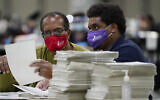 Officials sort ballots during an audit at the Georgia World Congress Center in Atlanta, on November 14, 2020. (Brynn Anderson/AP)