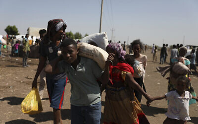 Refugees from the Tigray region of Ethiopia arrive at Hamdayet, Sudan on Saturday, November 14, 2020. (AP Photo/Marwan Ali)