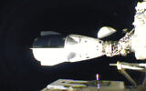 The SpaceX Dragon is seen after docking at the International Space Station, November 16, 2020. (NASA TV via AP)