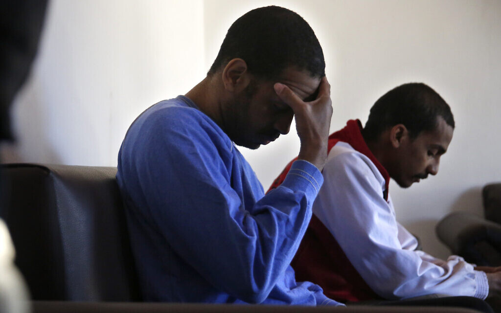 Alexanda Amon Kotey, left, and El Shafee Elsheikh, who were allegedly among four British jihadis who made up a brutal Islamic State cell dubbed 'The Beatles,' during an interview with The Associated Press at a security center in Kobani, Syria, March 30, 2018. (AP Photo/Hussein Malla, File) Alexanda Amon Kotey, left, and El Shafee Elsheikh, who were allegedly among four British jihadis who made up a brutal Islamic State cell dubbed 'The Beatles,' during an interview with The Associated Press at a security center in Kobani, Syria, March 30, 2018. (AP Photo/Hussein Malla, File)