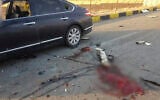 This photo released by the semi-official Fars News Agency shows the scene where Mohsen Fakhrizadeh was killed in Absard, a small city just east of the capital, Tehran, Iran, Nov. 27, 2020. Parts of image are blurred for potentially disturbing imagery. (Fars News Agency via AP)