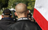 Illustrative: A man wears a jacket with writing on the collar which reads 'White Power' at a neo-Nazi rally in Berlin, October 10, 2009. (AP Photo)
