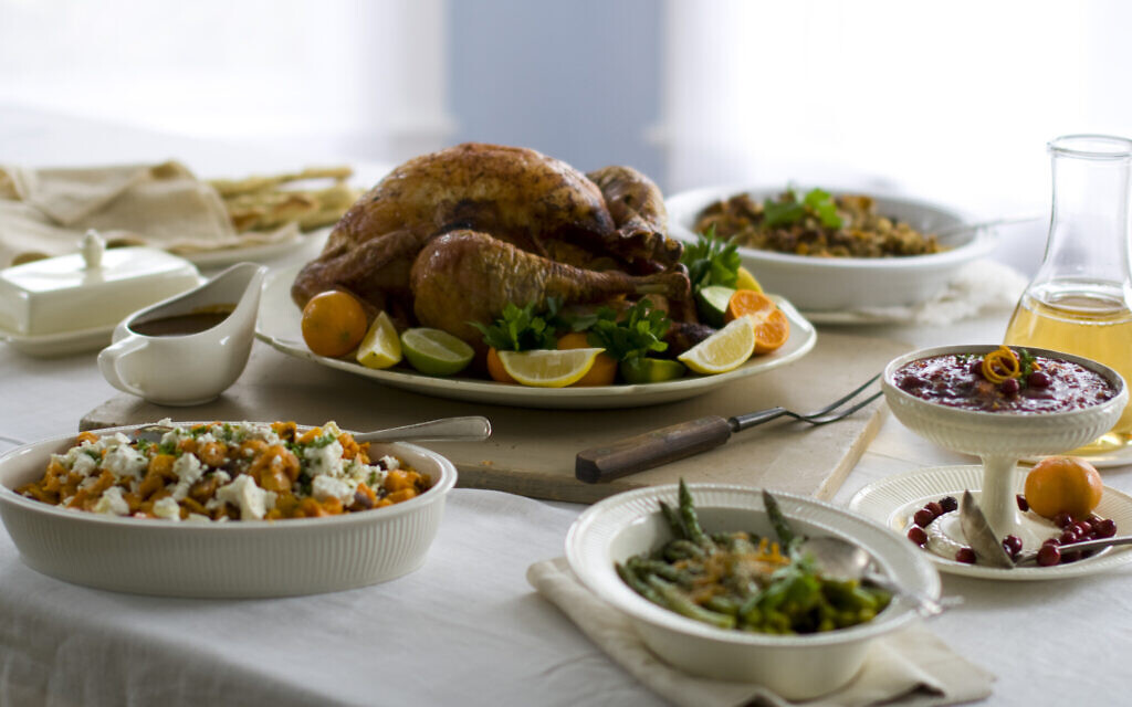 A Thanksgiving turkey surrounded by side dishes.  (AP Photo/Matthew Mead, FIle)