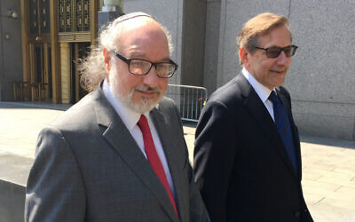 Convicted spy Jonathan Pollard, left, with his lawyer, Eliot Lauer, leaves federal court in New York following a hearing, Friday, July 22, 2016. (AP/Larry Neumeister)