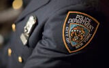 Illustrative: A detail including the badge and shield of one of the newest members of the New York City police is seen during his graduation ceremony, June 29, 2017, in New York. (AP Photo/ Mary Altaffer/ File)