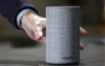 In this Sept. 27, 2017 photo, a new Amazon Echo is displayed during a program announcing several new Amazon products by the company, in Seattle. (AP Photo/Elaine Thompson, File)
