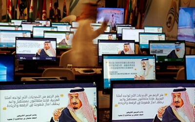 Illustrative: Screensavers showing King Salman are visible on computers at the press center for upcoming summits, in Mecca, Saudi Arabia, Thursday, May 30, 2019. Arabic on computers reads, "Despite all the challenges facing our Arab nation. We are optimistic about a promising future that fulfills the hopes of our nations for leadership." (AP Photo/Amr Nabil)