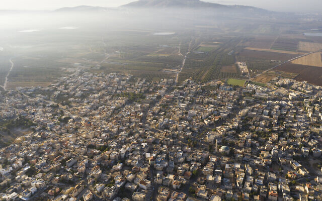In this September 27, 2019 photo, a general view of the Israeli Arab village of Iksal near Nazareth, in northern Israel. (AP/Oded Balilty) In this September 27, 2019 photo, a general view of the Israeli Arab village of Iksal near Nazareth, in northern Israel. (AP/Oded Balilty)
