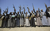 In this Sept. 21, 2019 file photo, Shiite Houthi tribesmen hold their weapons as they chant slogans during a tribal gathering showing support for the Houthi movement, in Sanaa, Yemen (AP Photo/Hani Mohammed)