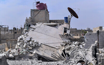 Illustrative: This photo released by the Syrian official news agency SANA, shows the rubble of a house that according to the Syrian authorities was attacked by an Israeli airstrike, in the Damascus suburbs of Hajira, Syria, Monday, April 27, 2020.  (SANA via AP)
