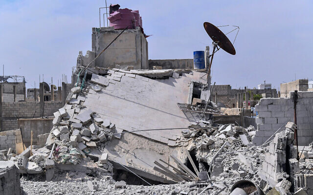 Illustrative: This photo released by the Syrian official news agency SANA, shows the rubble of a house that according to the Syrian authorities was attacked by an Israeli airstrike, in the Damascus suburbs of Hajira, Syria, Monday, April 27, 2020. (SANA via AP) Illustrative: This photo released by the Syrian official news agency SANA, shows the rubble of a house that according to the Syrian authorities was attacked by an Israeli airstrike, in the Damascus suburbs of Hajira, Syria, Monday, April 27, 2020. (SANA via AP)