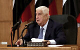 In this photo released by the Syrian official news agency SANA, Syrian Foreign Minister Walid al-Moallem speaks during a press conference, in Damascus, Syria, June 23, 2020 (SANA via AP)