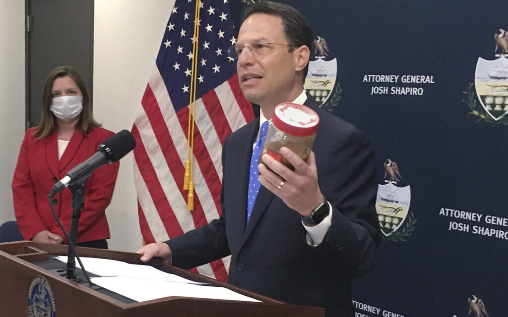 Pennsylvania Attorney General Josh Shapiro, right, holds a jar of discolored tap water during a news conference on June 25, 2020 in Harrisburg, Pennsylvania. (AP/Mark Scolforo) Pennsylvania Attorney General Josh Shapiro, right, holds a jar of discolored tap water during a news conference on June 25, 2020 in Harrisburg, Pennsylvania. (AP/Mark Scolforo)