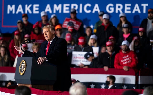 US President Donald Trump speaks during a campaign rally at Central Wisconsin Airport, in Mosinee, Wisconsin, September 17, 2020. (Evan Vucci/AP) US President Donald Trump speaks during a campaign rally at Central Wisconsin Airport, in Mosinee, Wisconsin, September 17, 2020. (Evan Vucci/AP)