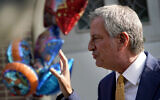 New York Mayor Bill de Blasio talks during a news conference outside the Mosaic Pre-K Center on the first day of school, Monday, Sept. 21, 2020, in New York. The city public schools delayed reopening for two weeks.(AP Photo/Mark Lennihan)
