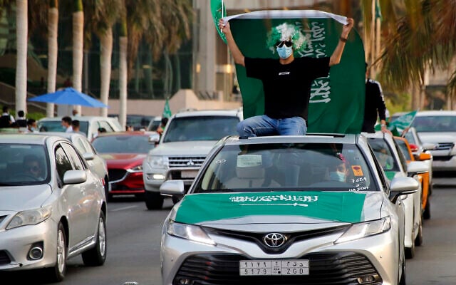A Saudi waves a national flag during celebrations marking National Day to commemorate the unification of the country as the Kingdom of Saudi Arabia, in Jiddah, Saudi Arabia, Sept. 23, 2020. (AP/Amr Nabil) A Saudi waves a national flag during celebrations marking National Day to commemorate the unification of the country as the Kingdom of Saudi Arabia, in Jiddah, Saudi Arabia, Sept. 23, 2020. (AP/Amr Nabil)
