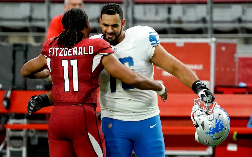 Arizona Cardinals wide receiver Larry Fitzgerald (11) greets Detroit Lions offensive guard Oday Aboushi (76) after an NFL football game, September 27, 2020, in Glendale, Arizona. (AP Photo/Rick Scuteri) Arizona Cardinals wide receiver Larry Fitzgerald (11) greets Detroit Lions offensive guard Oday Aboushi (76) after an NFL football game, September 27, 2020, in Glendale, Arizona. (AP Photo/Rick Scuteri)