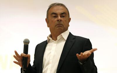 Nissan's former executive Carlos Ghosn gestures as he speaks during a press conference at the Holy Spirit University of Kaslik (USEK) in Kaslik, north of Beirut, Lebanon, September 29, 2020. (AP Photo/Hussein Malla)