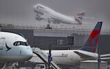 Aircraft are seen at London's Heathrow Airport, Thursday, Oct. 8, 2020 (Steve Parsons/PA via AP)