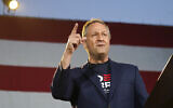 Doug Emhoff, husband of Democratic vice presidential candidate Kamala Harris, speaks during a car rally at East High School, late Thursday, Oct. 8, 2020, in Denver. Motorists took part in the rally to urge people to get out and vote in the upcoming election. (AP Photo/David Zalubowski)