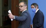 Rafael Mariano Grossi, right, director general of International Atomic Energy Agency (IAEA) and German Foreign Minister Heiko Maas, left, leave after a press conference as part of a meeting in Berlin, Germany, Oct. 26, 2020. (AP/Michael Sohn, pool)