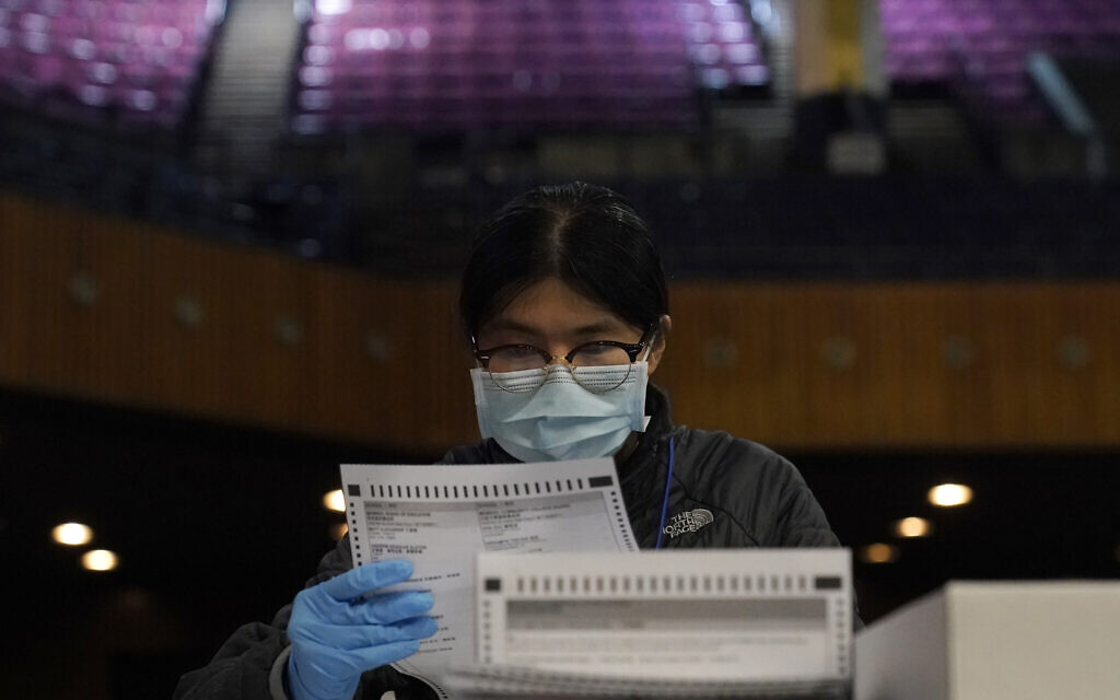 San Francisco Department of Elections worker Rosy Chan checks for damaged ballots at a voting center in San Francisco, November 1, 2020. (AP Photo/Jeff Chiu) San Francisco Department of Elections worker Rosy Chan checks for damaged ballots at a voting center in San Francisco, November 1, 2020. (AP Photo/Jeff Chiu)
