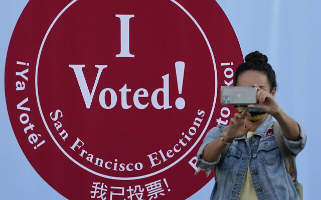 A woman takes a photo in front of an I Voted sign at a San Francisco Department of Elections voting center in San Francisco, Monday, Nov. 2, 2020, ahead of Election Day. (AP Photo/Jeff Chiu) A woman takes a photo in front of an I Voted sign at a San Francisco Department of Elections voting center in San Francisco, Monday, Nov. 2, 2020, ahead of Election Day. (AP Photo/Jeff Chiu)
