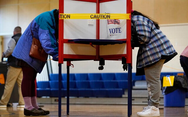 Caution tape closes off a voting stall to help distance voters to help prevent the spread of the coronavirus during Election Day at the East End School, November 3, 2020, in Portland, Maine. (AP Photo/Robert F. Bukaty) Caution tape closes off a voting stall to help distance voters to help prevent the spread of the coronavirus during Election Day at the East End School, November 3, 2020, in Portland, Maine. (AP Photo/Robert F. Bukaty)