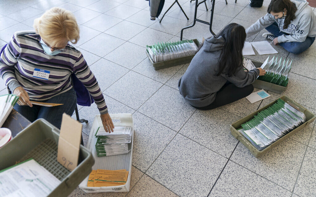 Election inspectors begin processing ballots on Election Day at City Hall in Warren, Mich., in Macomb County, Tuesday, Nov. 3, 2020. (AP/David Goldman)