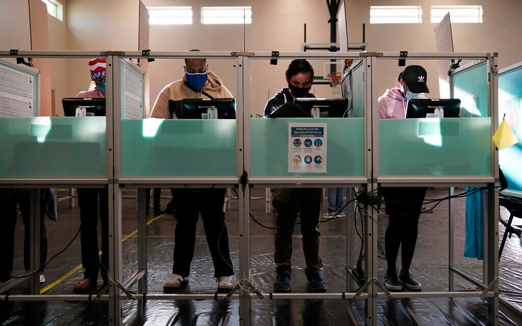 People vote at a polling place on Election Day, Tuesday, Nov. 3, 2020, in Las Vegas. (AP/John Locher)