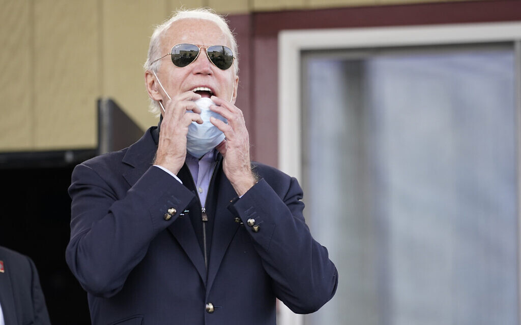 Democratic presidential candidate Joe Biden yells out to supporters as he departs Relish, a restaurant in Philadelphia, November 3, 2020. (AP Photo/Carolyn Kaster)