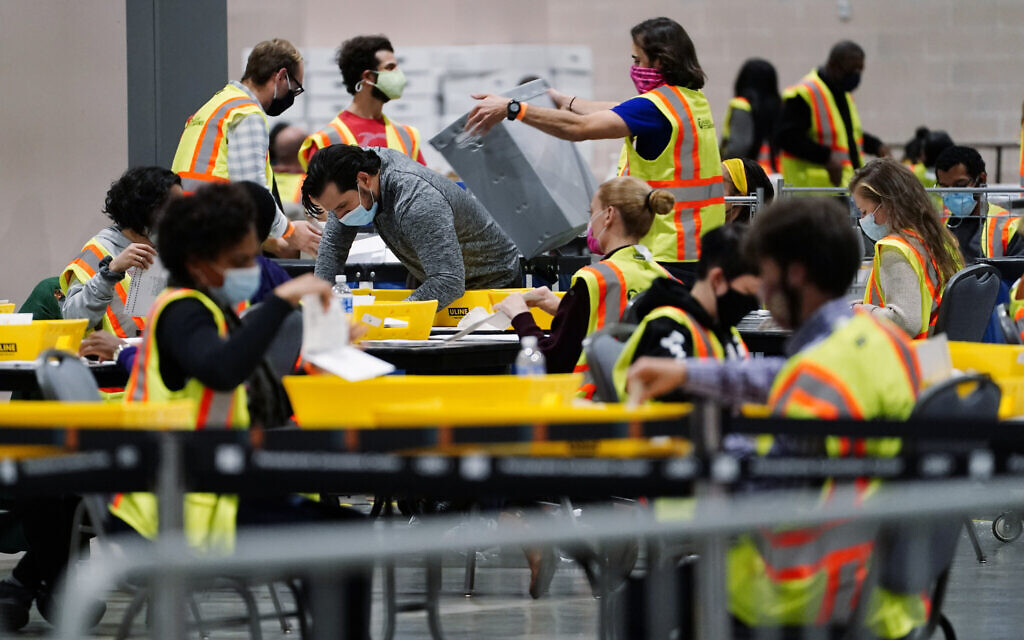 Philadelphia election workers process mail-in and absentee ballots for the general election, at the Pennsylvania Convention Center, Nov. 3, 2020, in Philadelphia. (AP Photo/Matt Slocum) Philadelphia election workers process mail-in and absentee ballots for the general election, at the Pennsylvania Convention Center, Nov. 3, 2020, in Philadelphia. (AP Photo/Matt Slocum)