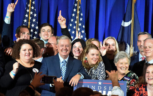 Supporters pose with US Sen. Lindsey Graham, center, following his victory speech after winning another term in office on Tuesday, Nov. 3, 2020, in Columbia, South Carolina (AP Photo/Meg Kinnard) Supporters pose with US Sen. Lindsey Graham, center, following his victory speech after winning another term in office on Tuesday, Nov. 3, 2020, in Columbia, South Carolina (AP Photo/Meg Kinnard)