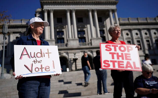 People demonstrate outside the Pennsylvania State Capitol, Friday, November 6, 2020, in Harrisburg, Pennsylvania, as vote counting continued. (AP Photo/Julio Cortez) People demonstrate outside the Pennsylvania State Capitol, Friday, November 6, 2020, in Harrisburg, Pennsylvania, as vote counting continued. (AP Photo/Julio Cortez)